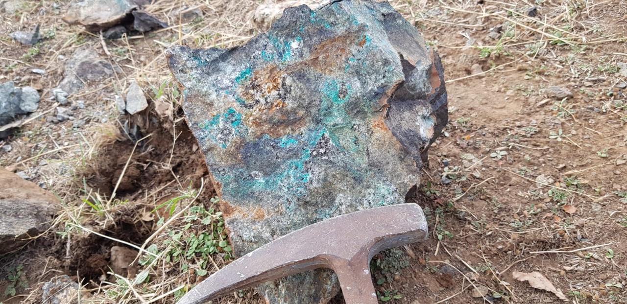 Copper ore with rock hammer