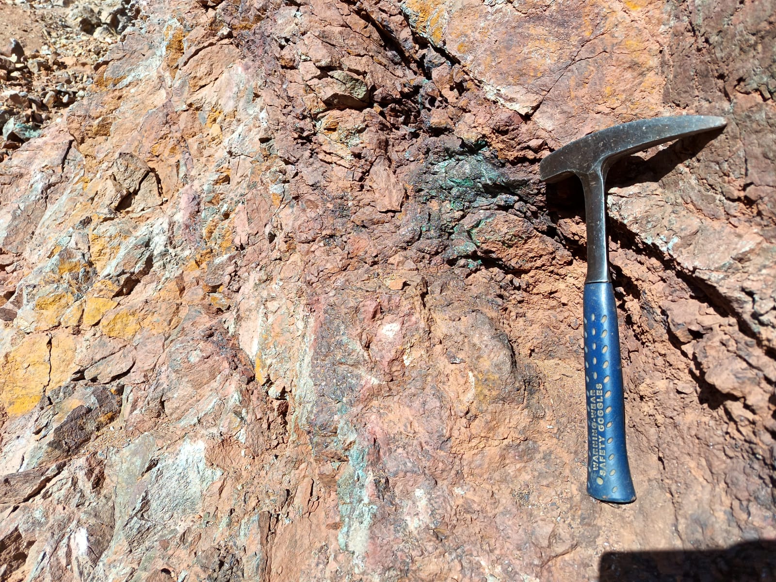 Mineralized rock with hammer