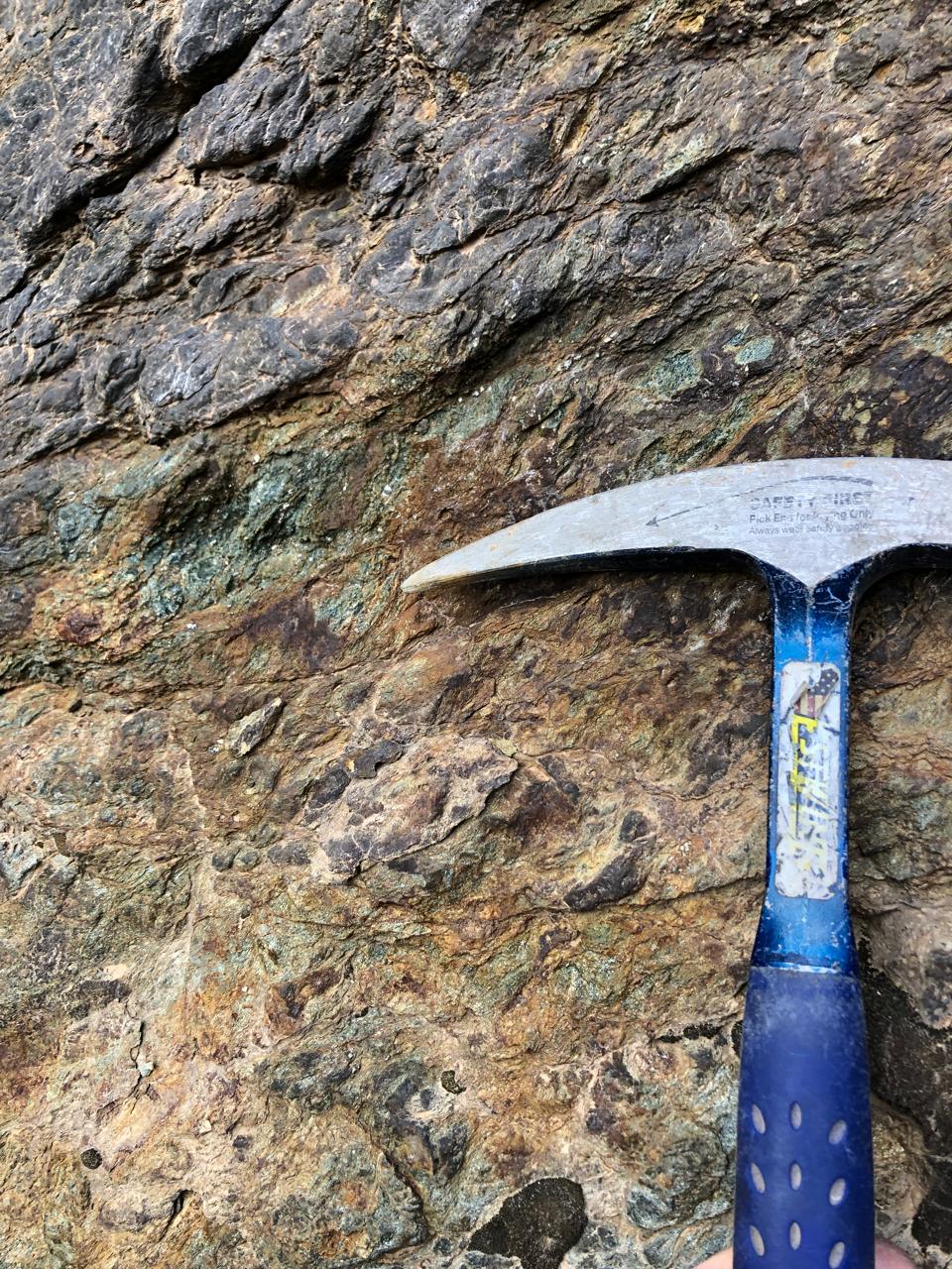 Rock hammer closeup on formation